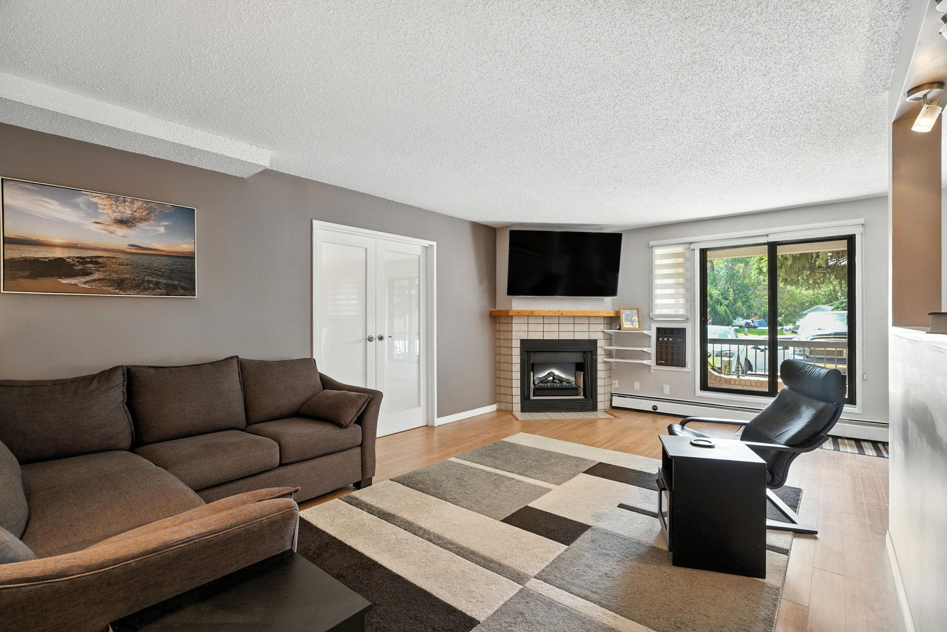 #110 - 209A Cree Place living room, saskatoon condo for sale